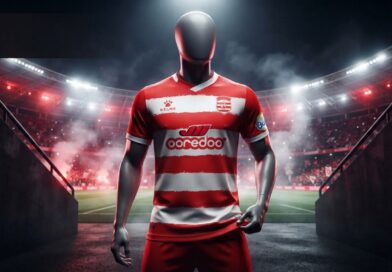 A professional, ultra-realistic photograph of a faceless grey mannequin standing in a dark, dramatic stadium tunnel, wearing the detailed red and white striped football jersey from image_64.png, complete with all logos (KElme, Club Africain crest, ooredoo, Boga) perfectly rendered and sharp.